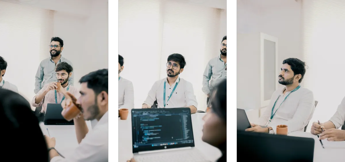 Vizipp team members in a meeting around a conference table, with laptops and coffee