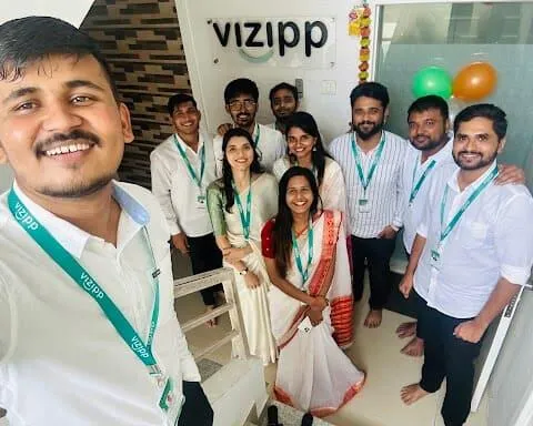 Vizipp team celebrating together at the office