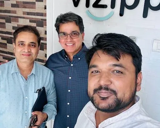 Vizipp team members at the office entrance